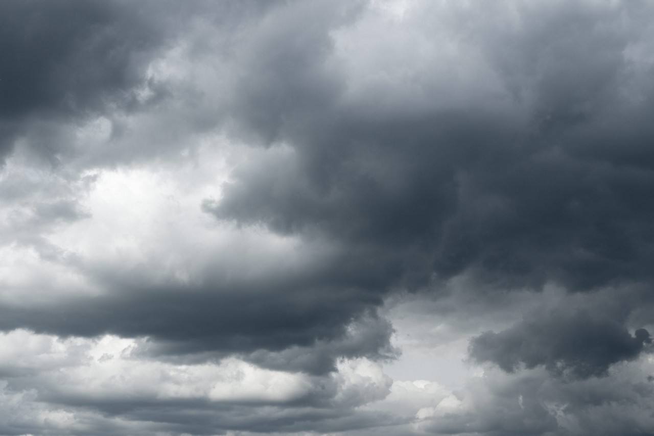 Thunderclouds over horizon, dark, gray.