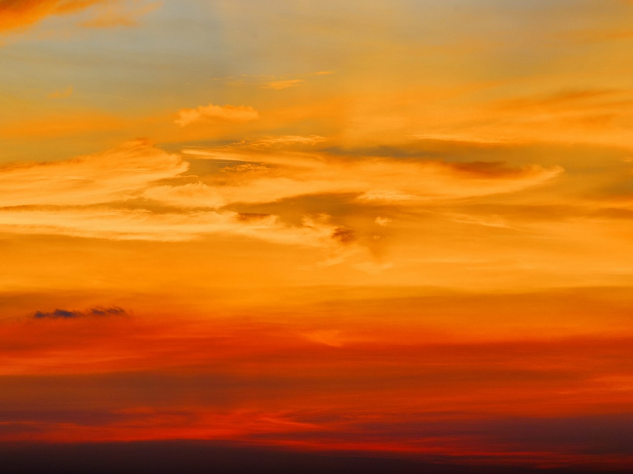 Fiery orange sunset sky. Beautiful sky background.
