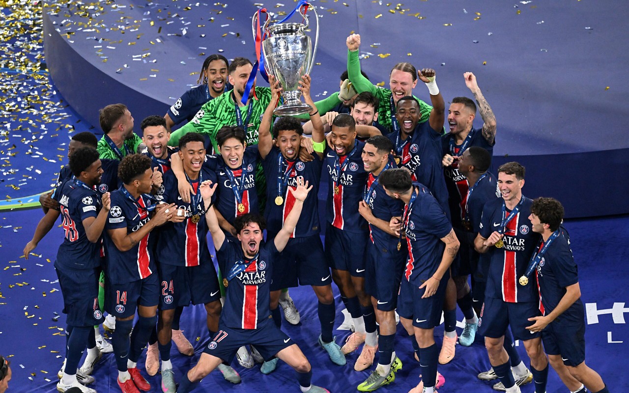 Paris Saint-Germain's players celebrate with the trophy after the UEFA Champions League final football match Paris Saint-Germain (PSG) and Inter Milan in Munich, southern  on May 31, 2025. (Photo by Kirill KUDRYAVTSEV / AFP)