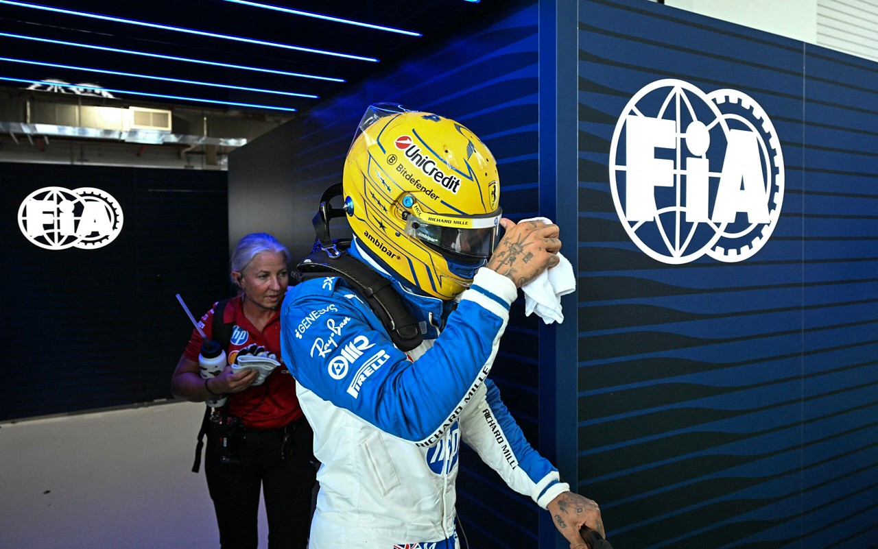 Ferrari's British driver Lewis Hamilton exits the garage after the qualifying session for the 2025 Miami Formula One Grand Prix at Miami International Autodrome in Miami Gardens, Florida, on May 3, 2025. (Photo by CHANDAN KHANNA / AFP)