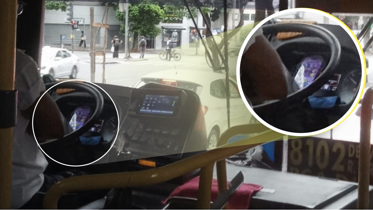 Imagem mostra o motorista jogando enquanto dirige na avenida de BH