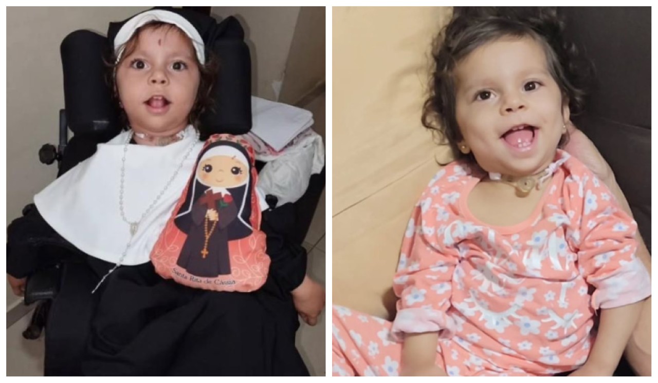 A pequena Maria Eduarda, fantasiada de Santa Rita de Cássia; apesar das limitações, a pequena não deixa de sorrir