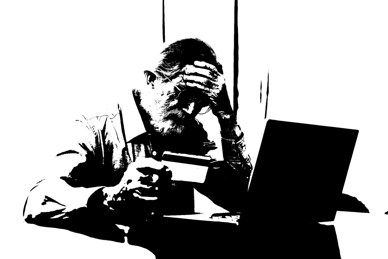 Upset senior elderly man holding credit card by laptop having trouble worry finance safety data or online payment security. Bank client concerned about problem with credit card, financial fraud threat