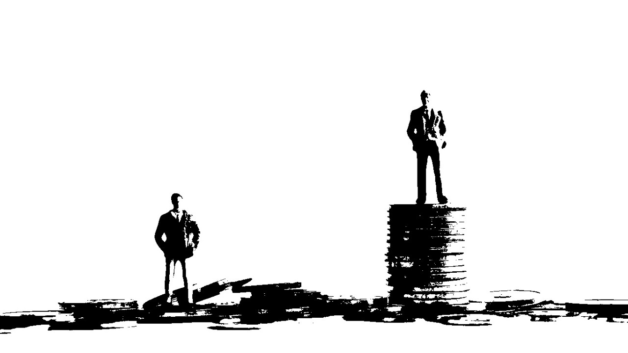 Miniature people standing on a pile of coins.