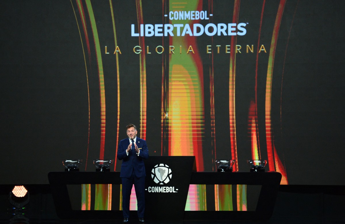 CONMEBOL President Paraguayan Alejandro Dominguez delivers a speech during the draw for the group stage of the Copa Libertadores and Copa Sudamericana at Conmebol's headquarters in Luque, Paraguay, on March 17, 2025. (Photo by DANIEL DUARTE / AFP)