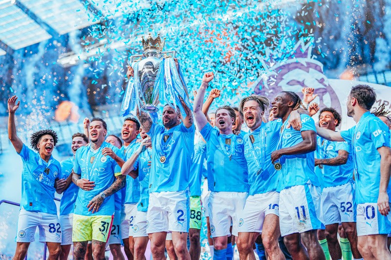 Kyle Walker of Manchester City lifts the Premier League trophy following the Premier League match between Manchester City and West Ham United at the Etihad Stadium, Manchester, England. Sunday 19th May 2024. (Photo by Tom Flathers/Manchester City FC)