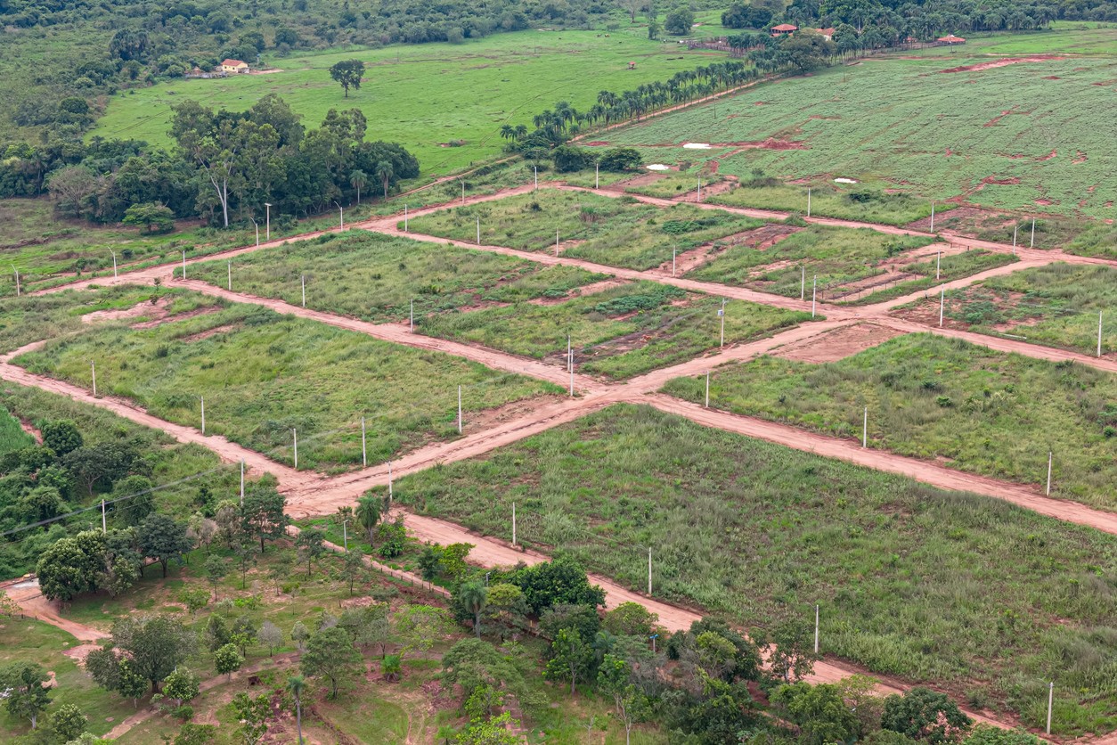 Itaja, Goias, Brazil - 04 13 2024: aerial image of new subdivision for houses, dirt road and power poles