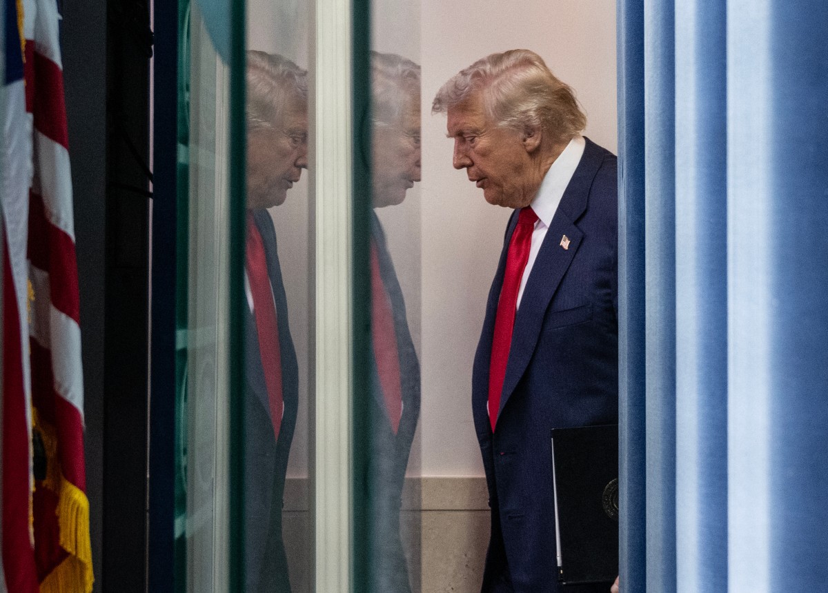 US President Donald Trump arrives for a news conference to discuss crime in Washington, DC, in the Brady Press Briefing Room at the White House in Washington, DC, on August 11, 2025. President Donald Trump announced Monday that he was deploying National Guard troops and putting the Washington police force under federal control to tackle crime in the US capital. "This is Liberation Day in DC, and we're going to take our capital back," Trump said at a White House press conference. (Photo by ANDREW CABALLERO-REYNOLDS / AFP)