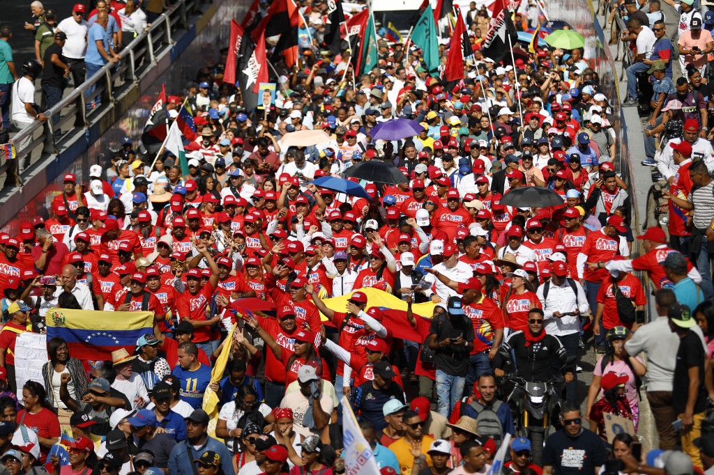 Supporters of Venezuelan President Nicolas Maduro take part in a demonstration backing the presidential election results in Caracas on August 3, 2024. Venezuela braced for fresh protests after President Nicolas Maduro's disputed election victory was ratified on the eve -- and a growing number of nations recognized his opposition rival as the true winner. (Photo by Pedro Rances Mattey / AFP)