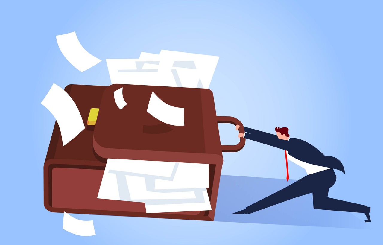 The hard-working businessman, exhausted and overworked, the businessman pulls a briefcase full of documents