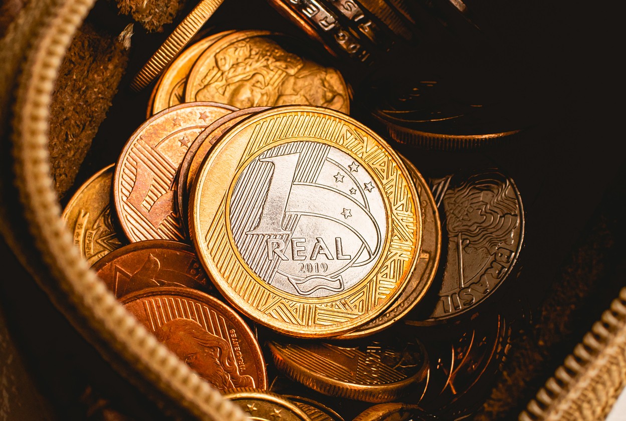 Real - BRL, money from Brazil. Brazilian coins inside a coin purse with a view from above and close-up photo. Brazilian economy, 1 Real currency, finance.