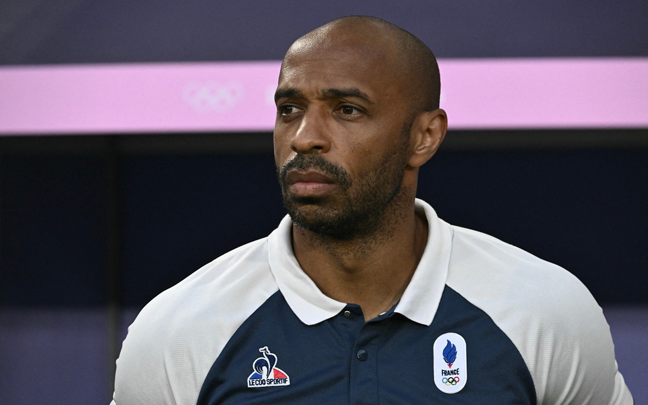 (FILES) 's coach Thierry Henry is seen before the men's quarter-final football match between  and Argentina during the Paris 2024 Olympic Games at the Bordeaux Stadium in Bordeaux on August 2, 2024. Thierry Henry has decided to step down as coach of the French U-21 team after reaching the final of the Paris-2024 Olympic Games, the French Football Federation announced on August 19, 2024. (Photo by Philippe LOPEZ / AFP)